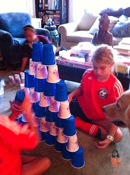 20 Brilliant Indoor Games For Kids That Are Perfect for Any Occasion 10 Cup Stacking Relay