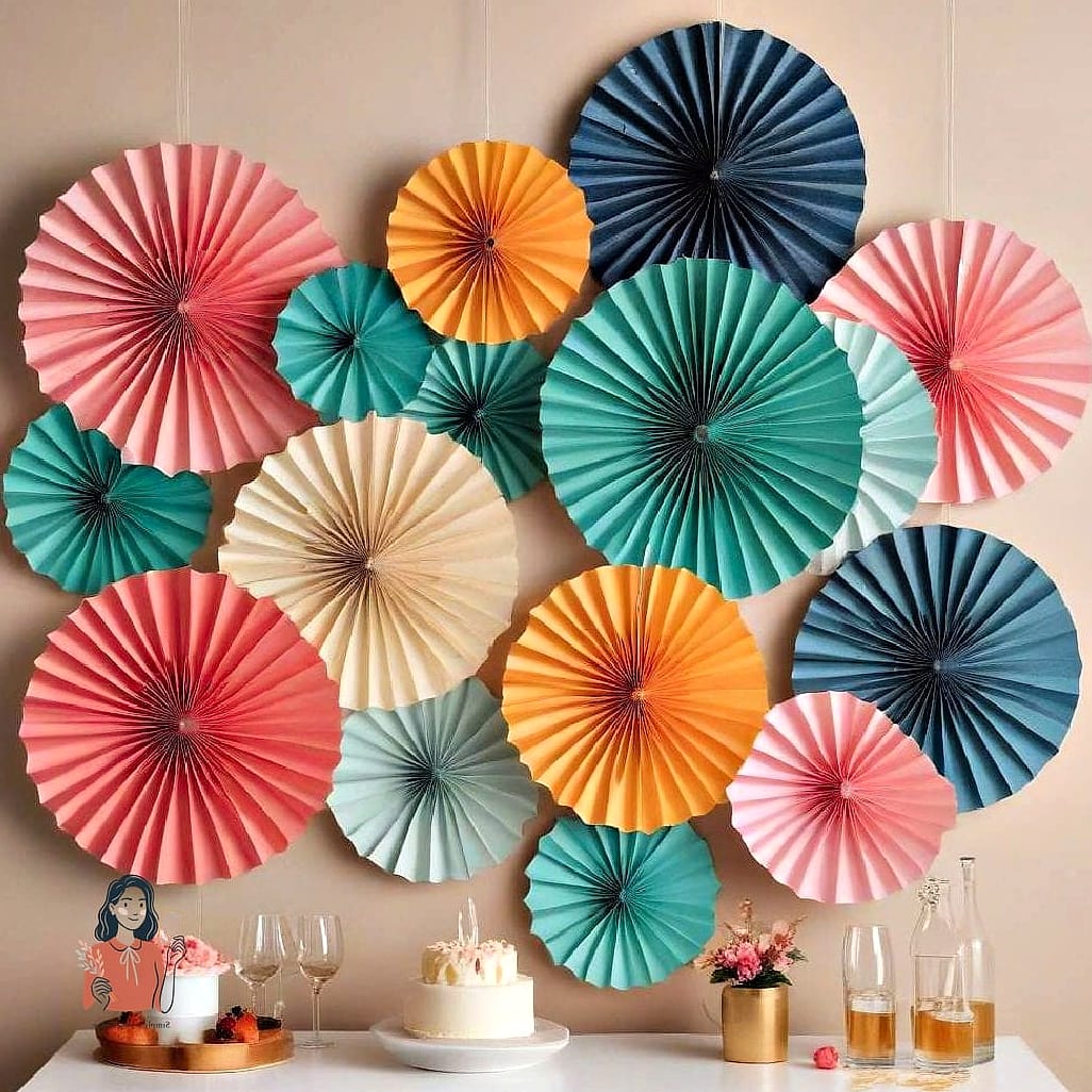 25 Incredible Party Decorations Worth Stealing Right Now 6 Paper Fans as Wall Decor